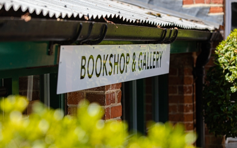 A sign in The Stables reading Bookshop & Gallery