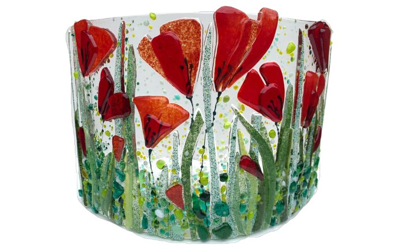A warm glass piece with poppy flowers.