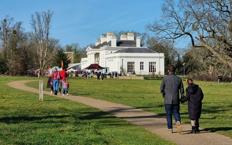 Visitors walking up to Hylands House where a food festival is taking place.