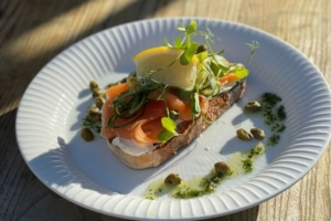 Grilled sourdough toast topped with smoked salmon and capers.