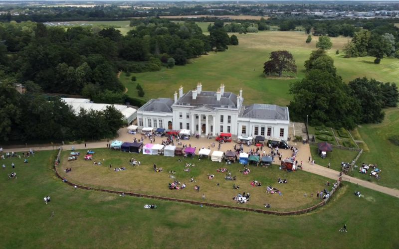 An aerial view of Hylands House with the Urban Food Fest market taking place outside,