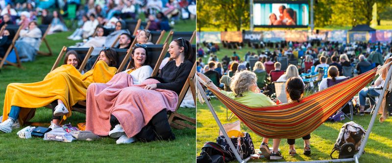 People sat in lawn chairs and hammocks watching a film on a large, outdoor cinema screen.