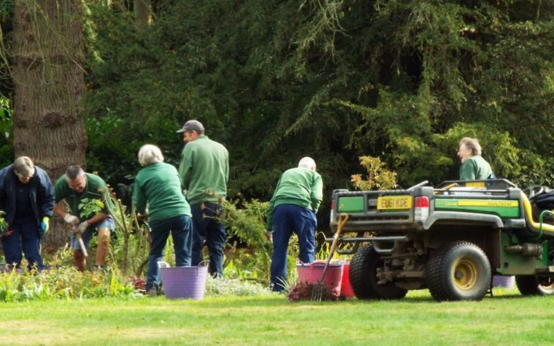Volunteers working in the flower beds in the Pleasure Garden.