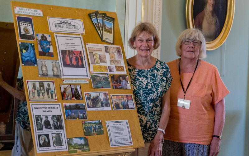 Two of our Friends stand with their information board about the Friends of Hylands House