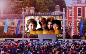 The Goonies showing on a large outdoor screen.