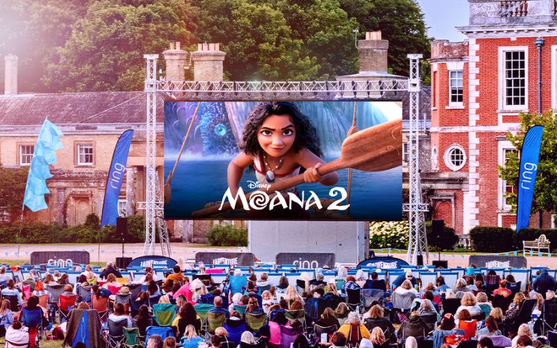 Moana 2 showing on a large outdoor screen.