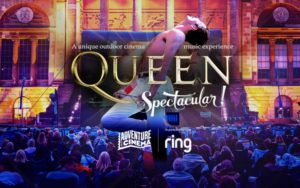 Queen Spectacular showing on a large outdoor screen.