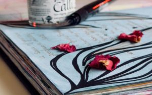 An open journal with sketches and writing.