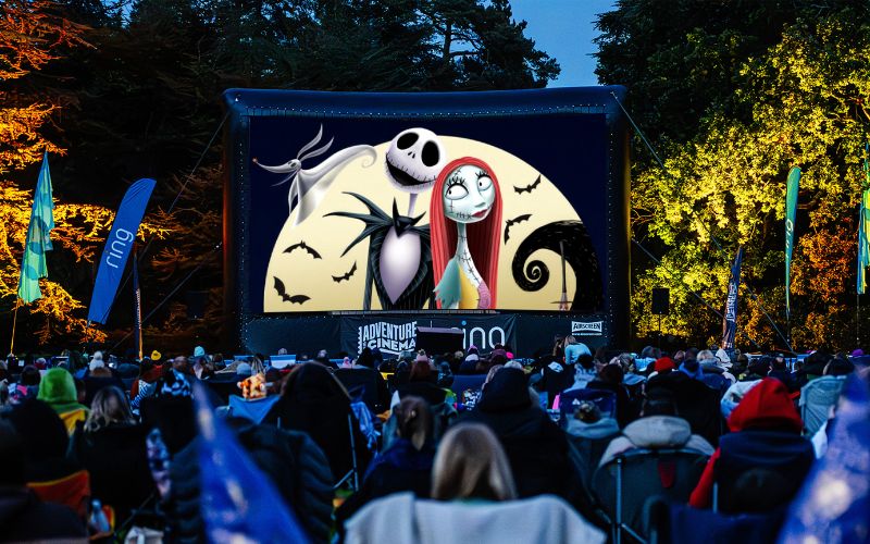 AC Nightmare Before Christmas The Nightmare Before Christmas being shown on a large, outdoor screen.