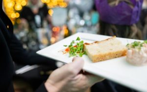 A festive appetiser being brought to a table.
