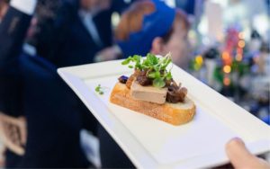 A festive appetiser being brought to a table.