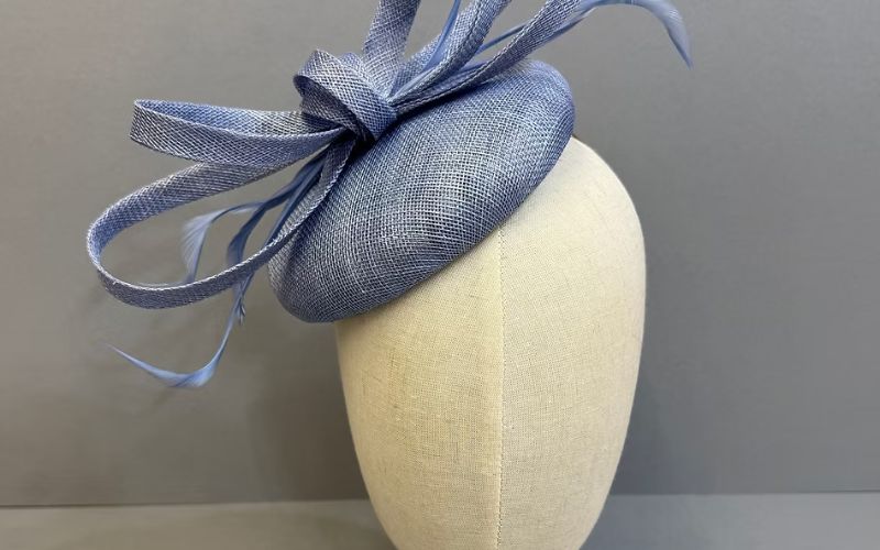 A light blue Sinamay Button Hat.