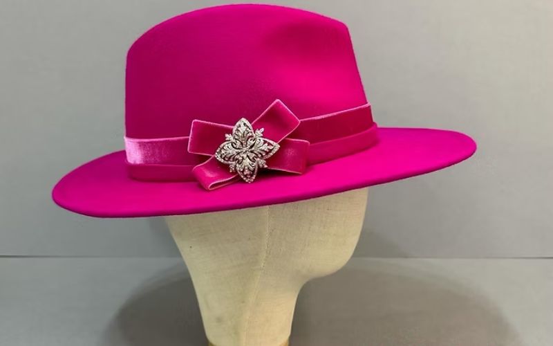 A bright pink ladies fedora hat.