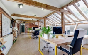 A large, open, bright studio space with desks.