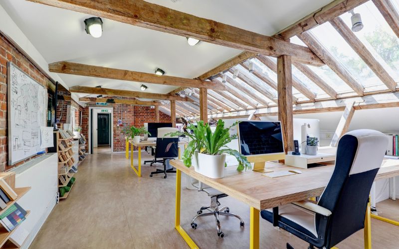 studio space A large, open, bright studio space with desks.